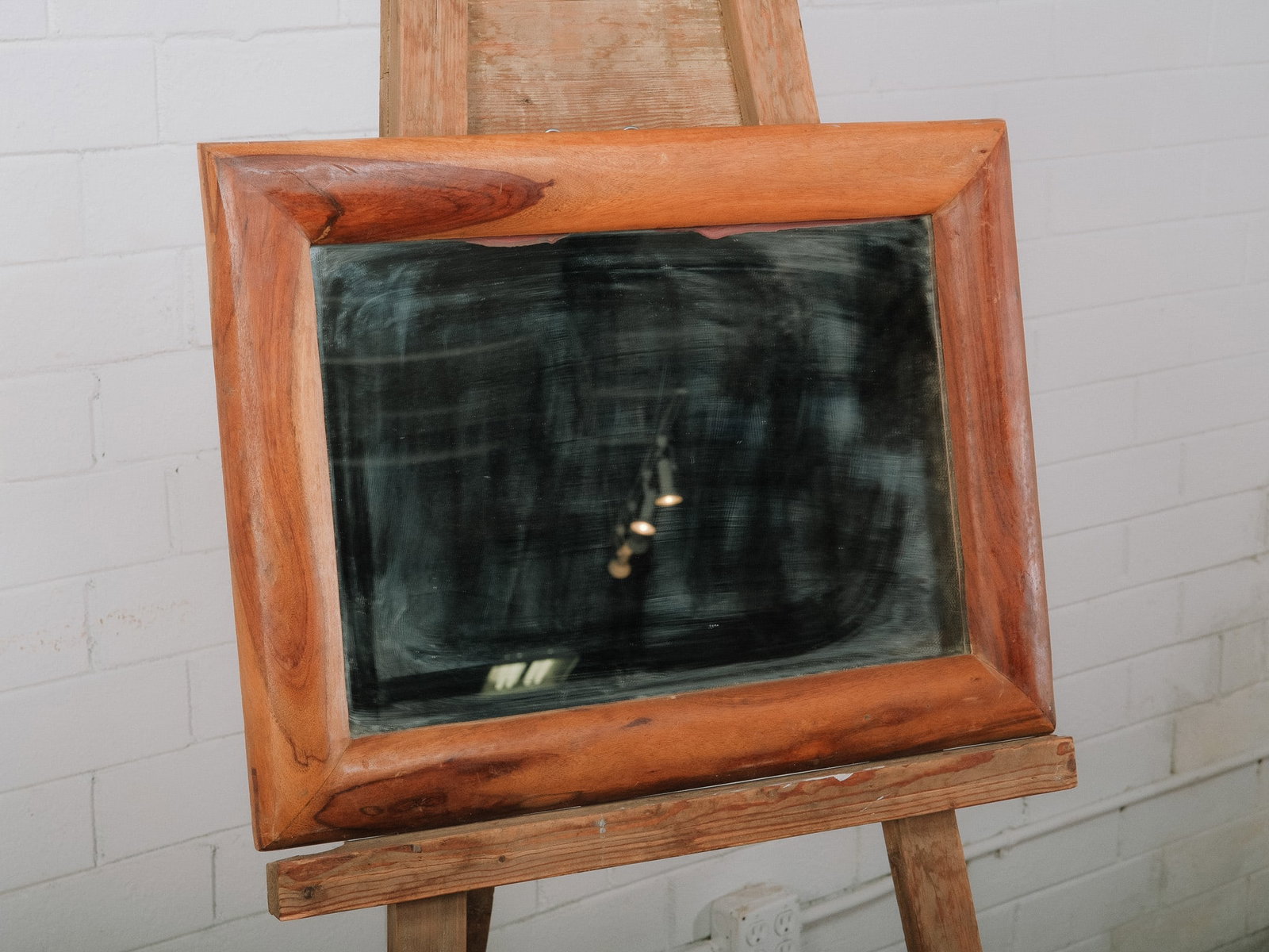 Rustic Solid Wood Framed Mirror: Wall mirror featuring a substantial solid wood frame with warm natural grain and softly rounded edges. The richly figured wood adds organic character while complementing the clean rectangular mirror. 