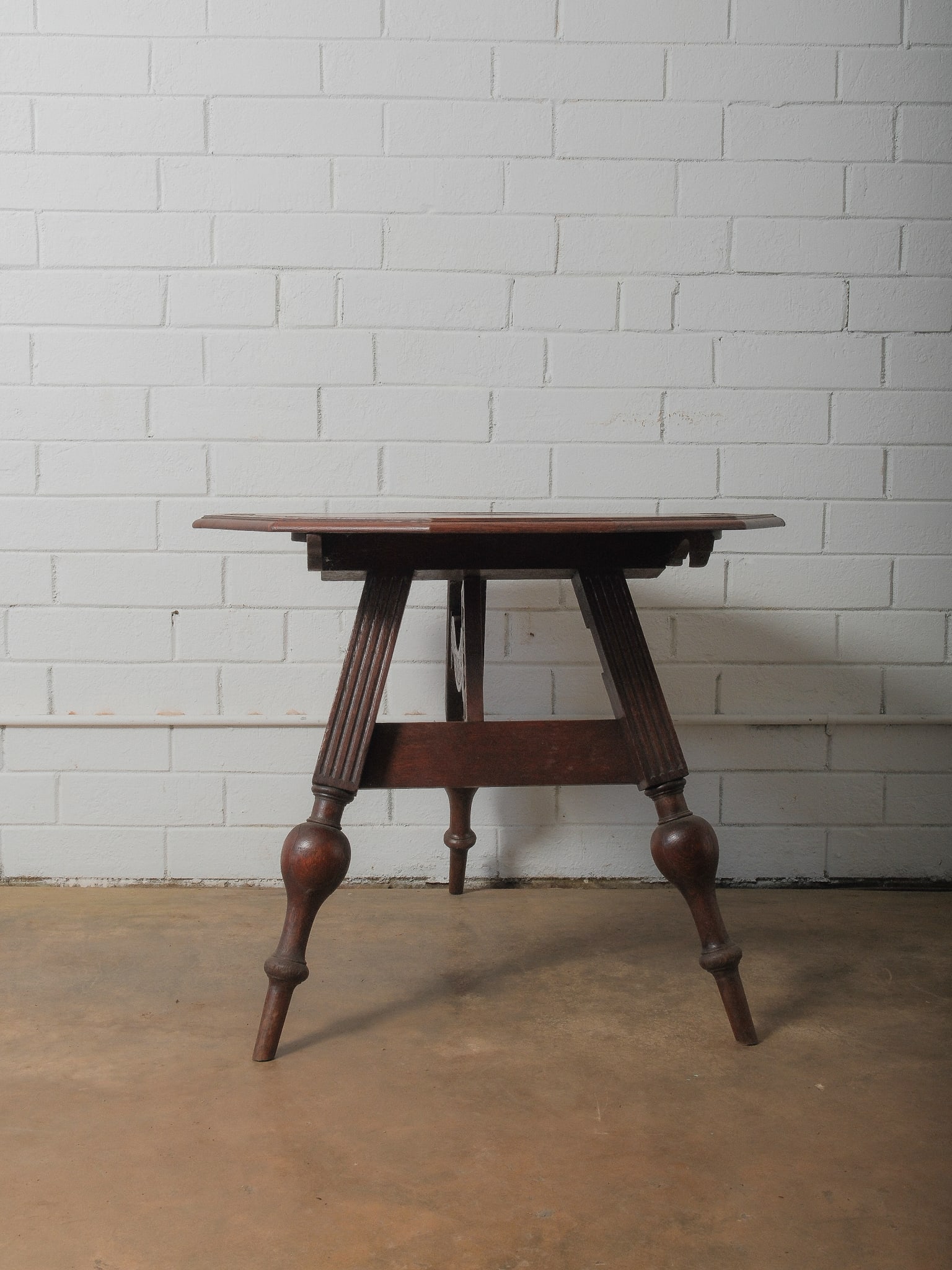 Oak Polygon Gateleg Table: A charming three-legged table with a polygonal top, supported by beautifully turned legs and a shaped apron. It's compact size makes it ideal as an accent table or plant stand.Approximate Dimensions: