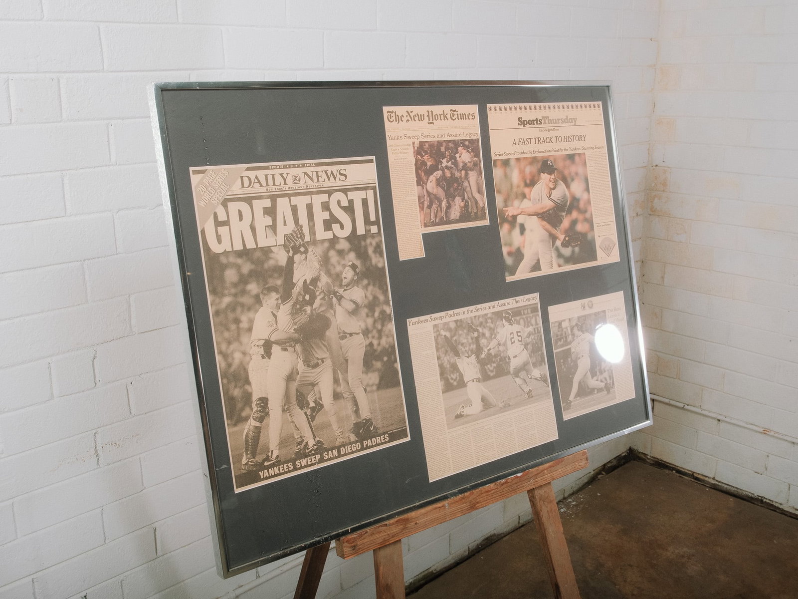 New York Yankees World Series Framed Newspaper Collection: Framed collection commemorating the New York Yankees World Series championship, featuring original newspaper front pages and articles celebrating the historic victory. Professionally matted and