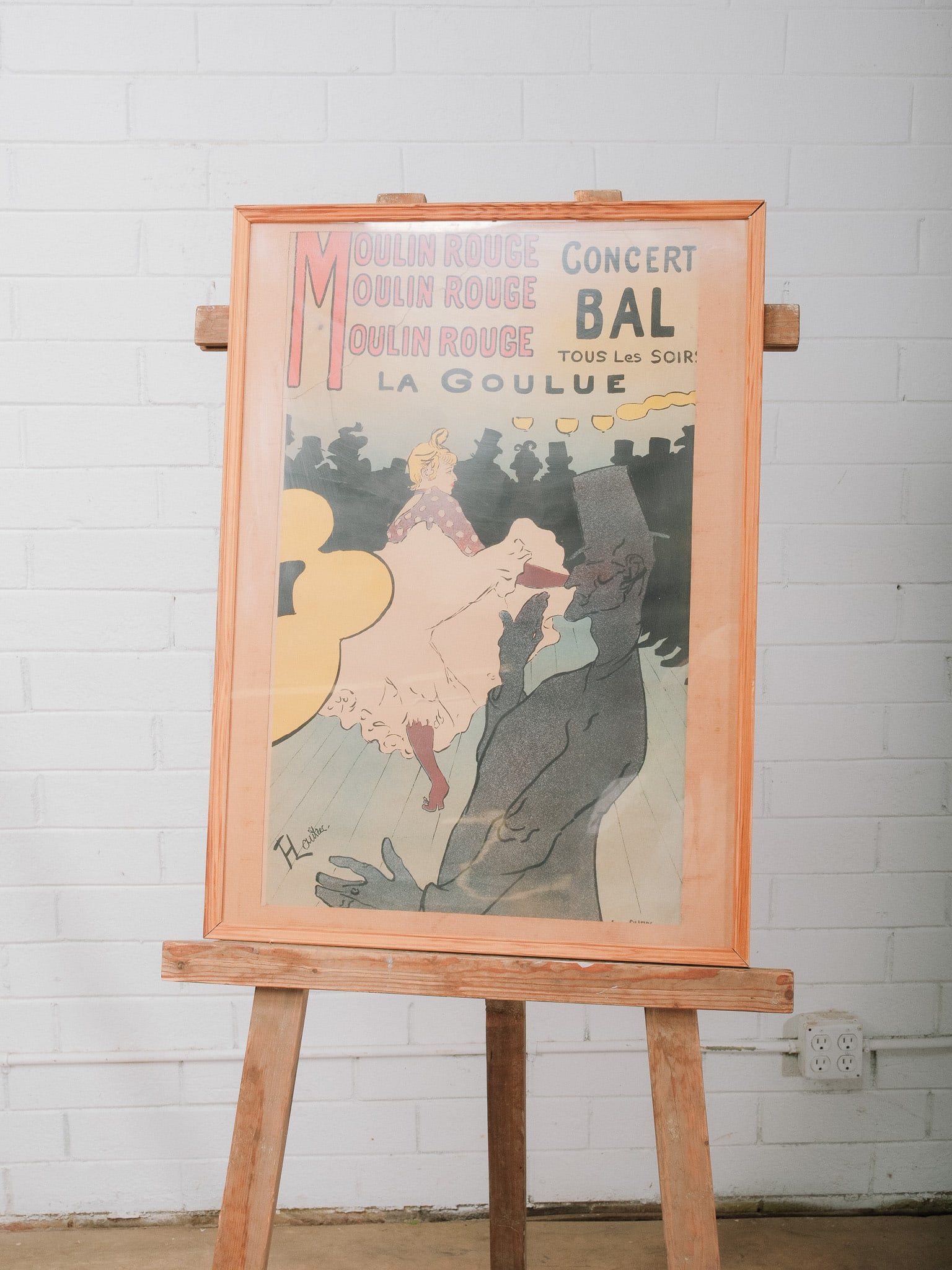 Framed Moulin Rouge: La Goulue Poster: Framed reproduction of Henri de Toulouse-Lautrec's celebrated Moulin Rouge: La Goulue poster. Featuring one of the most recognizable images of Belle Époque Paris, this colorful print makes a