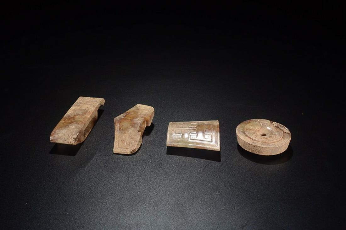 SET OF ANTIQUE JADE OF SWORD ORNAMENTS: Sword head Diameter 5.2cm Thickness 1.8cm Weight 74g/ Sword stele Length 5.8cm Width 5cm Thickness 1.5cm Weight 72g/ Jiange Length 7.3cm Width 3.3cm Thickness 1.8cm Weight 41g/ Zhaowendai Length 9cm W