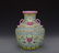 GREEN GROUND FAMILLE ROSE 'FLORAL' VASE WITH HANDLES,