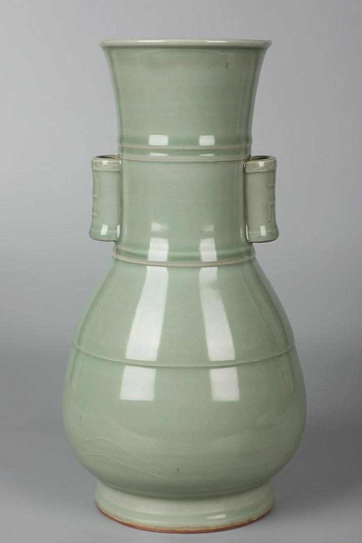LONGQUAN WARE VASE WITH HANDLES: Time: Song Dynasty 10-13 Century / Height 11.22 in / Mouth-Diameter 3.94 in / Base-Diameter 4.33 in