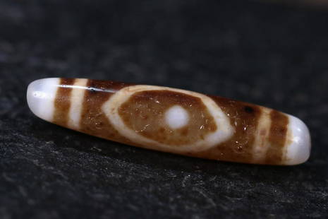 DZI BEAD: 56mm/ *12.5mm/ Ã—13mm Description Statement: Any description statement is given as a courtesy to a client, is an opinion and should not be treated as a statement of fact and Merces Gallery shall