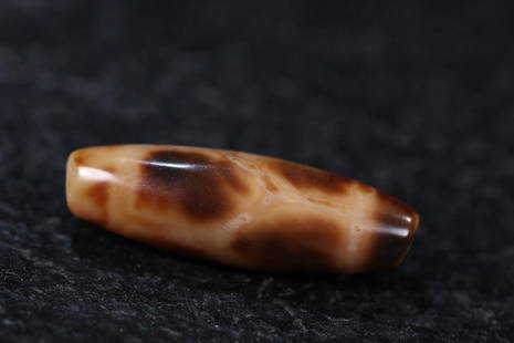 DZI BEAD: 42.5mm/ *13.5mm/ Ã—13mm Description Statement: Any description statement is given as a courtesy to a client, is an opinion and should not be treated as a statement of fact and Merces Gallery