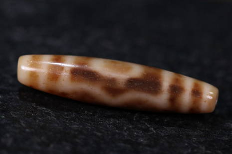 DZI BEAD: 57mm/ *14mm/ Ã—13mm Description Statement: Any description statement is given as a courtesy to a client, is an opinion and should not be treated as a statement of fact and Merces Gallery shall