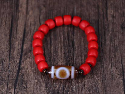 RED SHERPA GLASS BEADED BRACELET WITH DZI BEAD: Dzi Bead 2.94*1.32cm Description Statement: Any description statement is given as a courtesy to a client, is an opinion and should not be treated as a statement of fact and Merces Gallery shall have