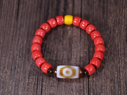 RED GLASS BEADED BRACELET WITH DZI BEAD: Dzi Bead 2.95*1.33cm Description Statement: Any description statement is given as a courtesy to a client, is an opinion and should not be treated as a statement of fact and Merces Gallery shall have