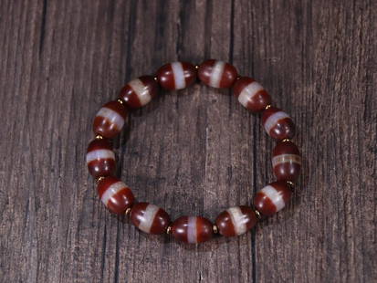 DZI BEADED BRACELET: 1.35*0.94cm Description Statement: Any description statement is given as a courtesy to a client, is an opinion and should not be treated as a statement of fact and Merces Gallery shall have no