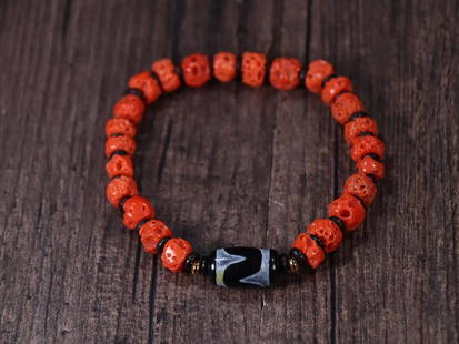 CORAL BEADED BRACELET WITH DZI BEAD: Coral 0.64*0.8cm/ Dzi Bead 1.78*1.05cm/ Weight 0.014kg Description Statement: Any description statement is given as a courtesy to a client, is an opinion and should not be treated as a statement of