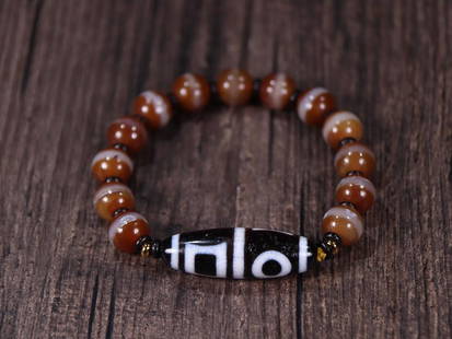 DZI BEADED NECKLACE: Dzi Bead 3.87*1.23cm Description Statement: Any description statement is given as a courtesy to a client, is an opinion and should not be treated as a statement of fact and Merces Gallery shall have