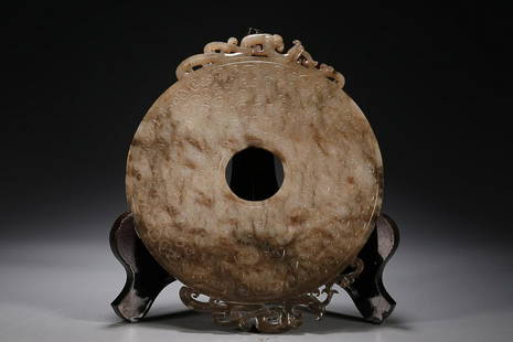 CHINESE ANTIQUE JADE BI DISC WITH CARVED 'DRAGON': 15.8Ã—0.4Ã—19.5cm/ Weight 310g Description Statement: Any description statement is given as a courtesy to a client, is an opinion and should not be treated as a statement of fact and Merces