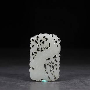 CHINESE HETIAN JADE OPENWORK PENDANT WITH CARVED 'BIRD AND PRUNUS': Length 6.3cm/ Width 4cm/ Thickness0.7cm/ Weight 0.036kg Description Statement: Any description statement is given as a courtesy to a client, is an opinion and should not be treated as a statement of