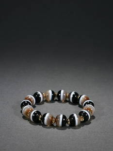 DZI BEADED BRACELET: Bead-Diameter 1.15cm/ Weight 40.8g Description Statement: Any description statement is given as a courtesy to a client, is an opinion and should not be treated as a statement of fact and Merces