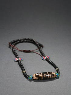 DZI NECKLACE: Bead-Diameter 4.1*1.25cm Description Statement: Any description statement is given as a courtesy to a client, is an opinion and should not be treated as a statement of fact and Merces Gallery shall