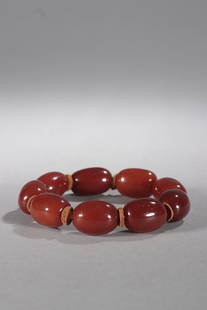 CHINESE AMBER BEADED BRACELET: Bead-Diameter: 2.1x1.6cm. Weight: 30g Description Statement: Any description statement is given as a courtesy to a client, is an opinion and should not be treated as a statement of fact and Merces