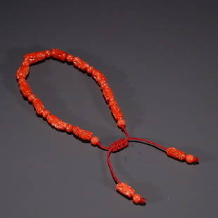 CHINESE CORAL BEADED BRACELET: Bead-Diameter: 0.5x1.1cm. Weight: 6g Description Statement: Any description statement is given as a courtesy to a client, is an opinion and should not be treated as a statement of fact and Merces