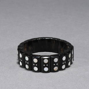 CHINESE NACRE-INLAID BLACK CORAL BANGLE: Width: 1.9cm. Weight: 36g Description Statement: Any description statement is given as a courtesy to a client, is an opinion and should not be treated as a statement of fact and Merces Gallery shall