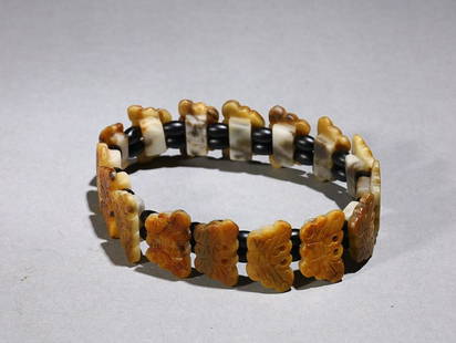 CHINESE HETIAN JADE BEADED BRACELET WITH CARVED 'BUTTERFLY': Single Length: 2cm, Width: 1.2cm, Thickness: 0.6cm. Weight: 94g Description Statement: Any description statement is given as a courtesy to a client, is an opinion and should not be treated as a
