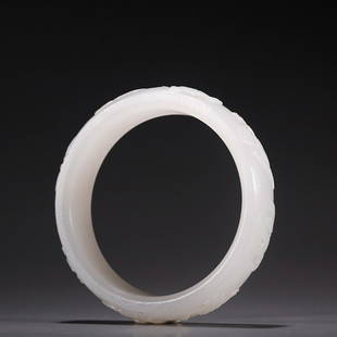 CHINESE HETIAN JADE BANGLE WITH CARVED 'ASHTAMANGALA': Thickness: 0.85x1.7cm, Inner-Diameter: 6cm. Weight: 70g Description Statement: Any description statement is given as a courtesy to a client, is an opinion and should not be treated as a statement of