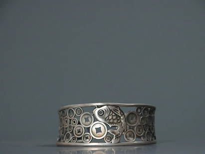 SILVER BANGLE WITH OPENWORK 'FISH AND COINS': Thickness 2.5cm/ Width 6.1cm Description Statement: Any description statement is given as a courtesy to a client, is an opinion and should not be treated as a statement of fact and Merces Gallery