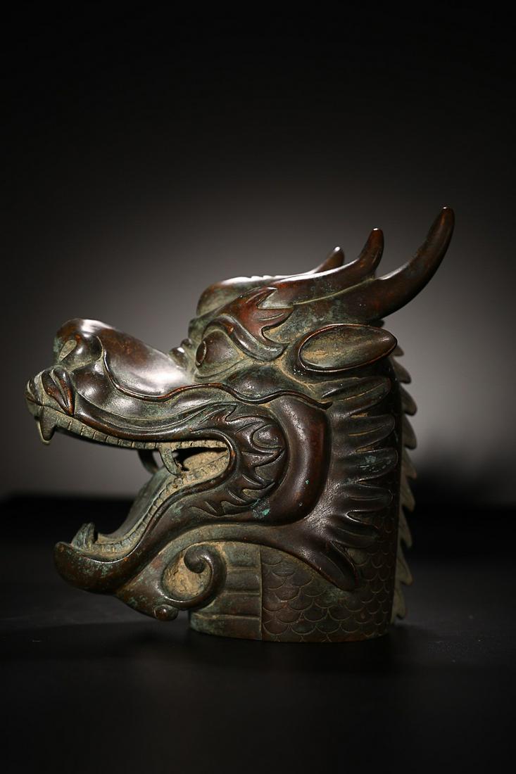 CHINESE BRONZE DRAGON: 16x11.5x15.8cm. Weight: 0.263kg Description Statement: Any description statement is given as a courtesy to a client, is an opinion and should not be treated as a statement of fact and Merces Gallery s