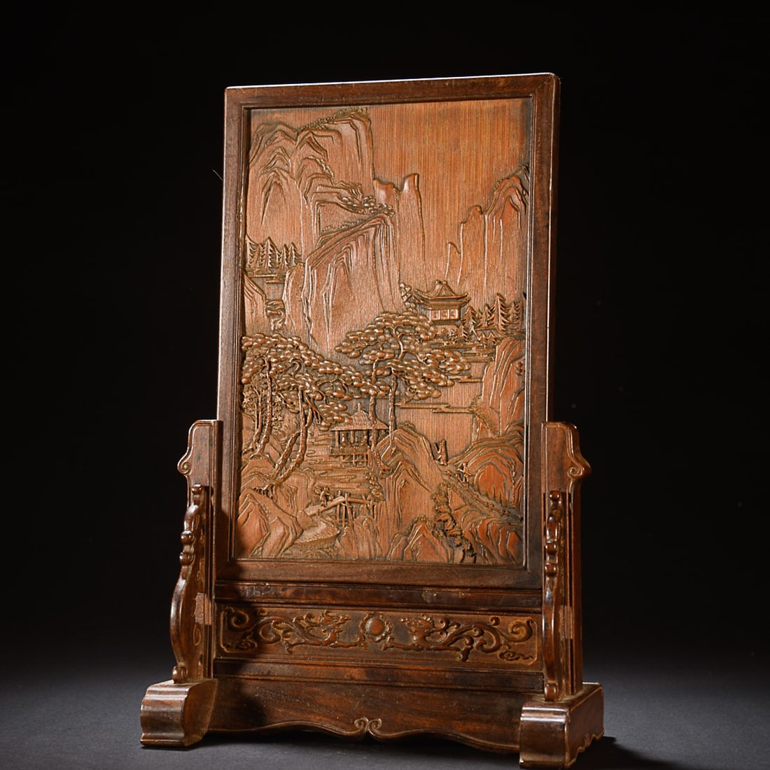 CHINESE BAMBOO-EMBELLISHED REDWOOD TABLE SCREEN, 'FIGURE IN A LANDSCAPE', 'ZHU JUN REN QI' MARK: Height: 29.3cm, Length: 18.3cm, Width: 10cm. Weight: 572g Description Statement: Any description statement is given as a courtesy to a client, is an opinion and should not be treated as a statement of