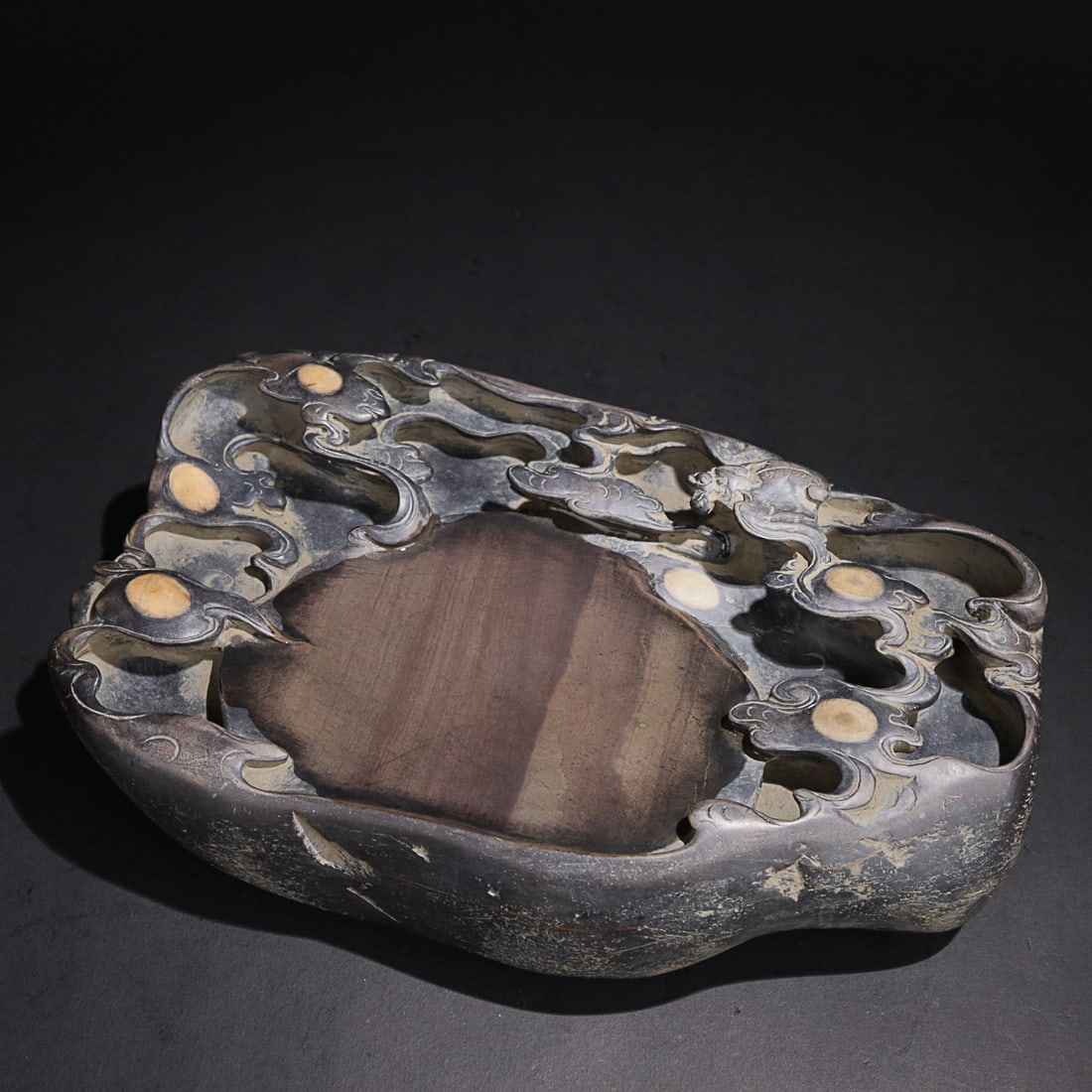 CHINESE DUAN STONE INKSTONE, 'LIU YUN NA FU', 'WANG REN KAN' MARK: Length: 24.4cm, Width: 14.2cm, Thickness: 7.2cm. Weight: 3.8kg Description Statement: Any description statement is given as a courtesy to a client, is an opinion and should not be treated as a stateme