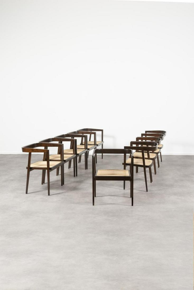 JOAQUIM TENREIRO (1906-1992) U chair Sui…: JOAQUIM TENREIRO (1906-1992) U chair Suite de dix chaises Palissandre et cannage. Reeks van tien stoelen Rozenhout en riet. Circa 1960. H.71,5 cm L.55 cm P.46 cm