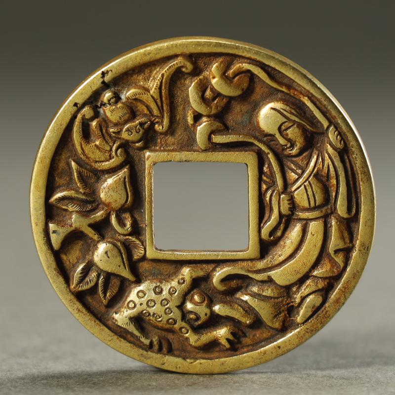 AN ARCHAISTIC  GILT-SILVER COIN (1 of 2)