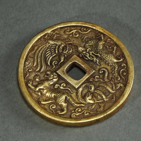 AN ARCHAISTIC GILT-BRONZE COIN (1 of 2)