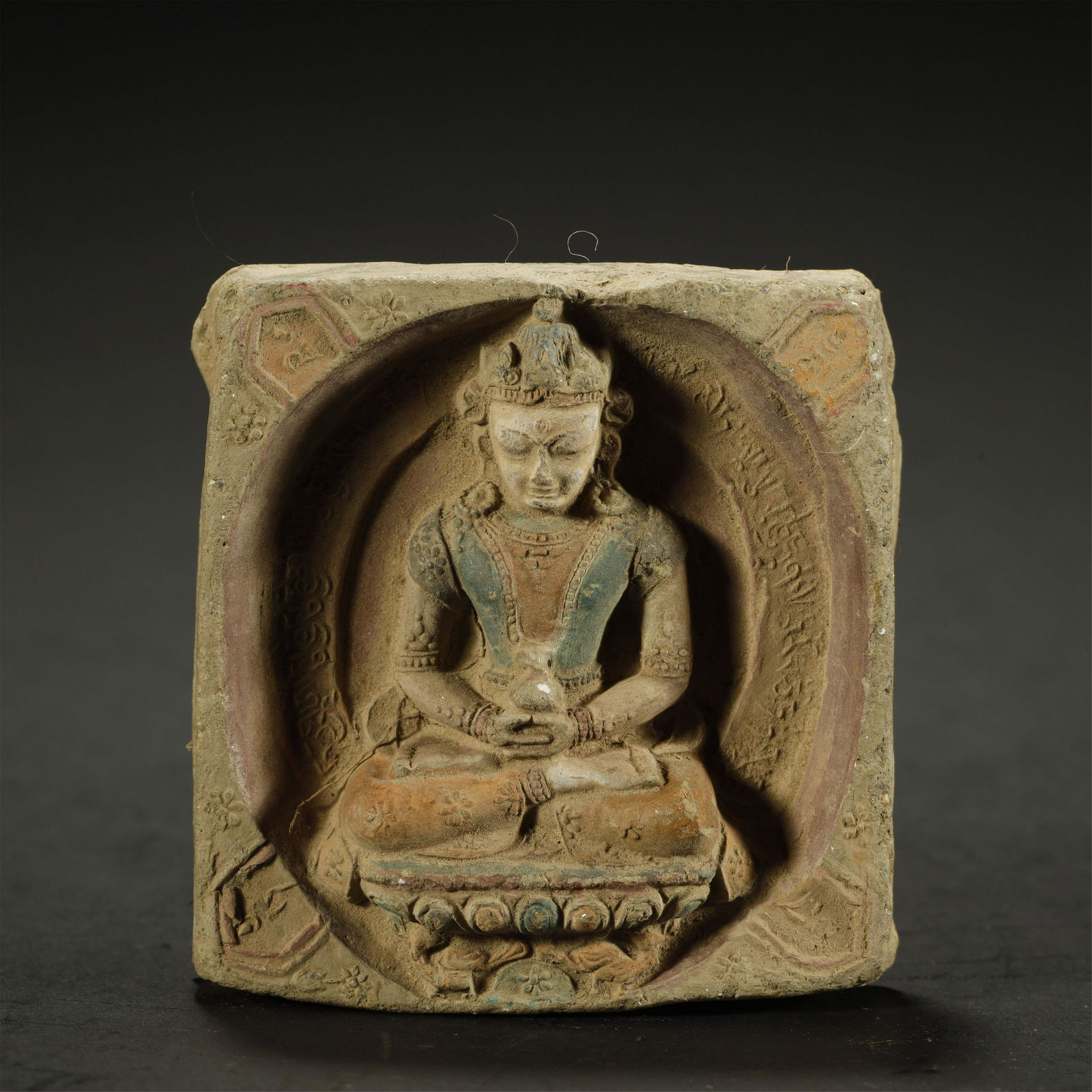 A TIBETAN PAINTED TSA-TSA PLAQUE (1 of 4)