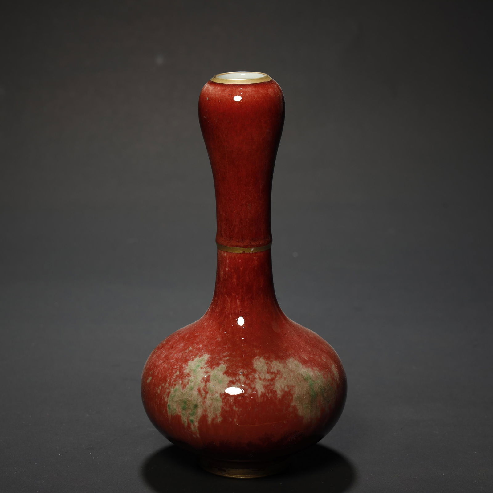 A CHINESE COPPER-RED GLAZED VASE (1 of 7)