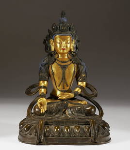 A GILT-DECORATED BRONZE SEATED BUDDHA STATUE: A GILT-DECORATED BRONZE SEATED BUDDHA STATUE H:31cm