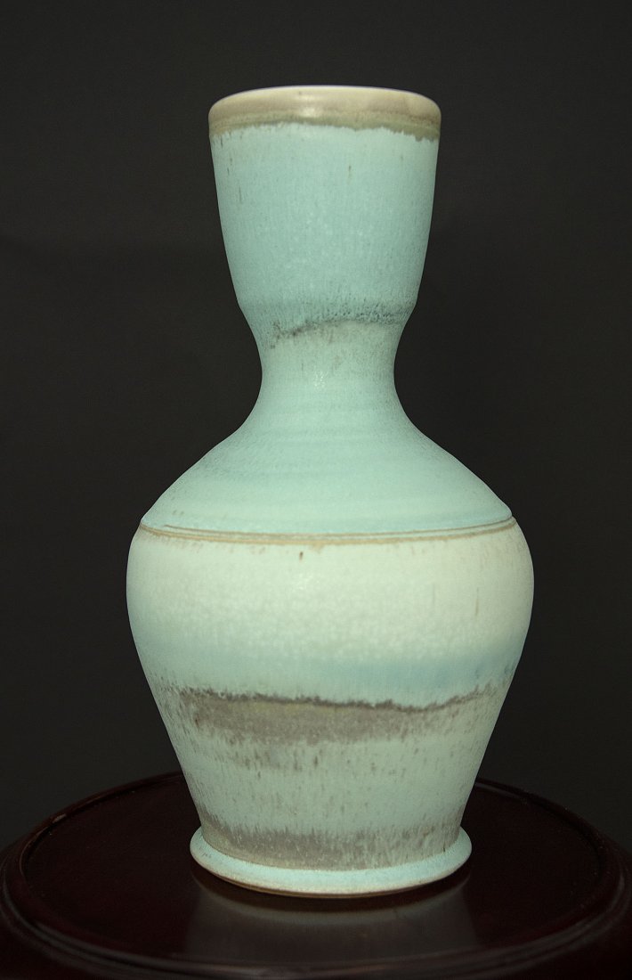 STAN IRVIN (American/Texas) A STONEWARE SCULPTURE: Aquatic View white stoneware, reduction fire to cone 10, layered copper and titanium glazes incised signature on bottom Height: 12 inches, Width: 5 inches, Depth: 5 inches Provenance: From the collect