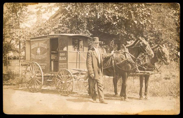 Grand Union Tea Company: Horse-drawn coffee delivery wagon. Located at 314 W. 2nd, Davenport, IA. Photo by Dyer And Son, Muscatine, IA. Corner worn, small stain.