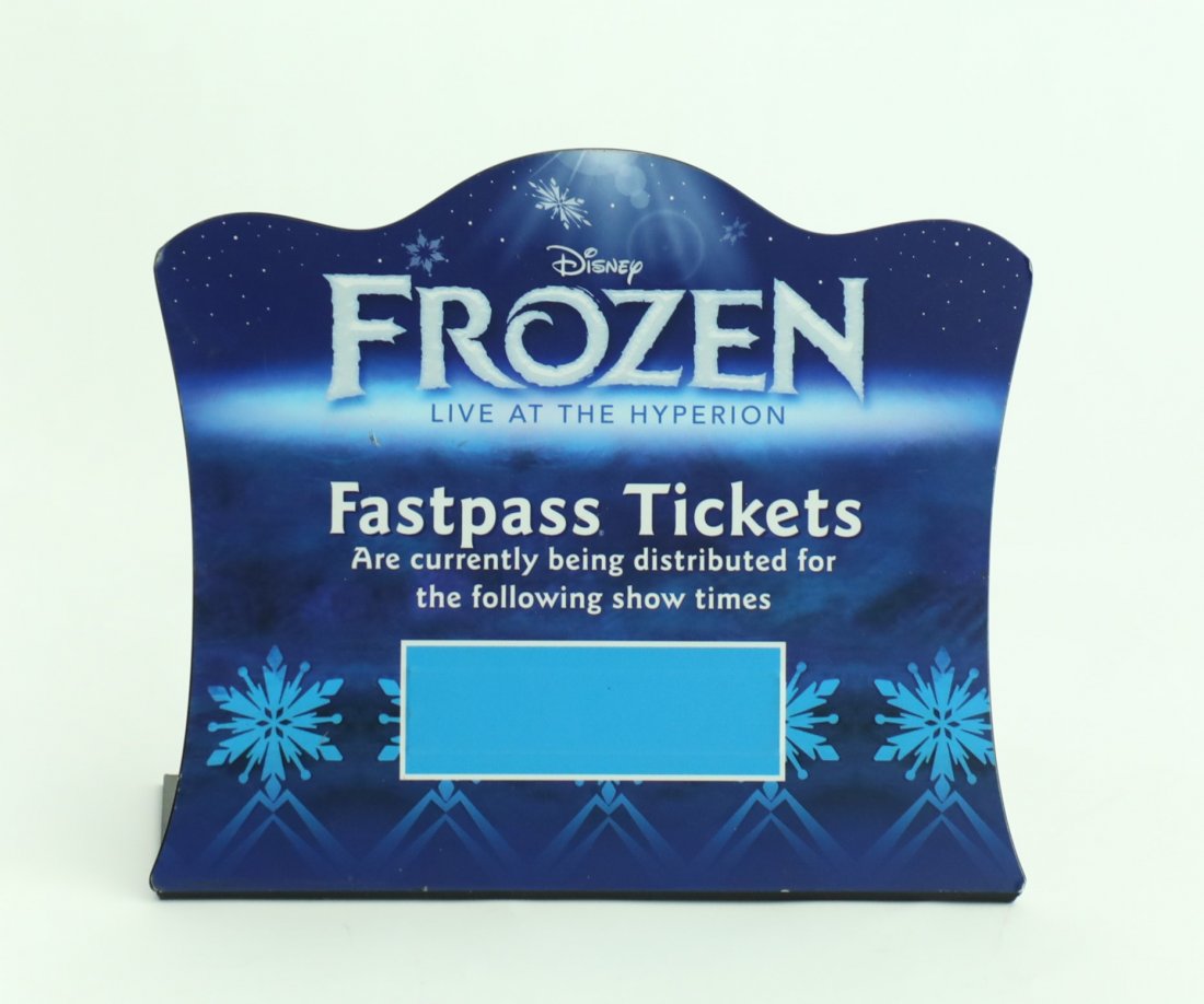 Frozen Live at the Hyperion Theater FastPass Sign: Small Fastpass Ticket sign from California Adventure. Sign is in good condition. This sign was displayed on an outdoors desk where Cast Members answered questions for guest. Made of plastic with vinyl