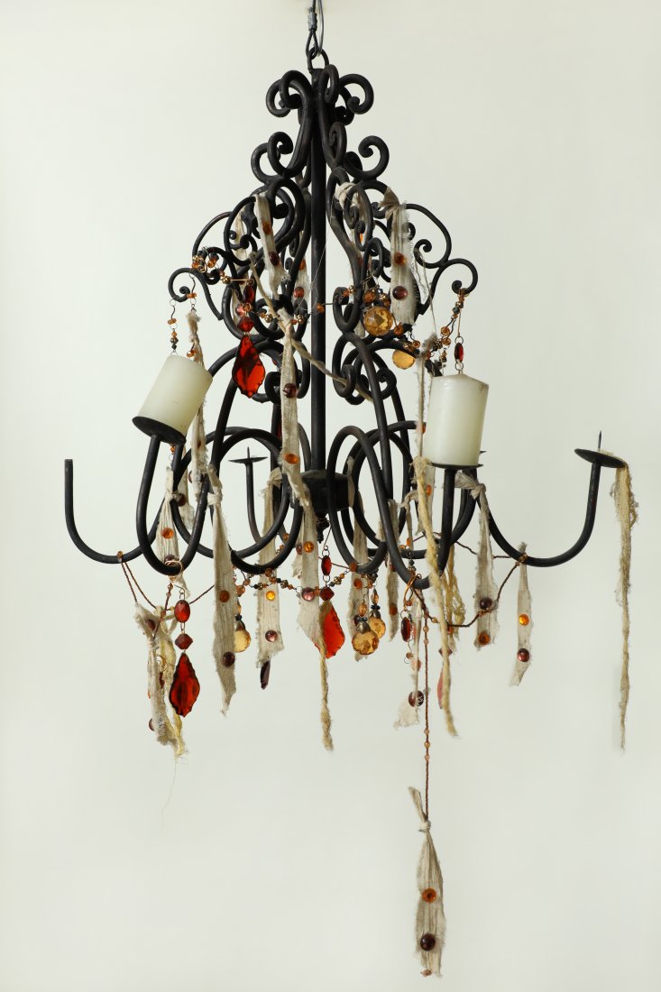 Pirates of the Caribbean Chandelier Prop: Damaged Pirates of The Caribbean Chandelier Prop. The Chandelier is made of metal and is decorated with fabrics, jewels, and candles. There are several missing parts.