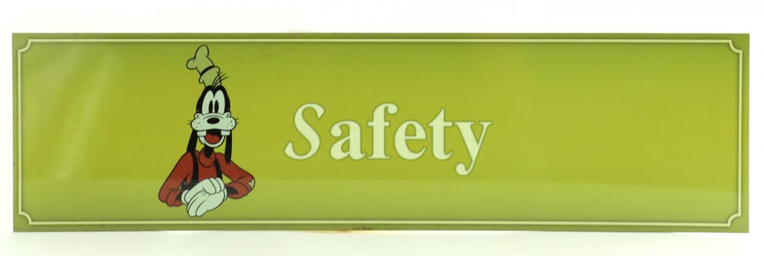 Disneyland Goofy "Safety" Park Sign: (Disneyland, c. 2000's). A park used prop safety sign featuring the Disney character Goofy. The sign is in good condition with normal wear from age and park use. Measures 22 x 6