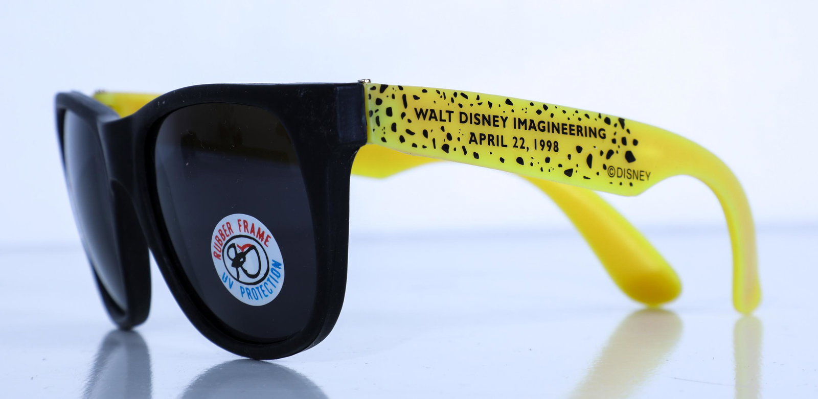 Disney Animal Kingdom WDI Cast Member Opening Day: (Disney Animal Kingdom, c. 1998). A rare pair of sunglasses given to Disney Imagineering cast members on the opening day of the park on April 22, 1998. The sunglasses are of a sleek black design with 