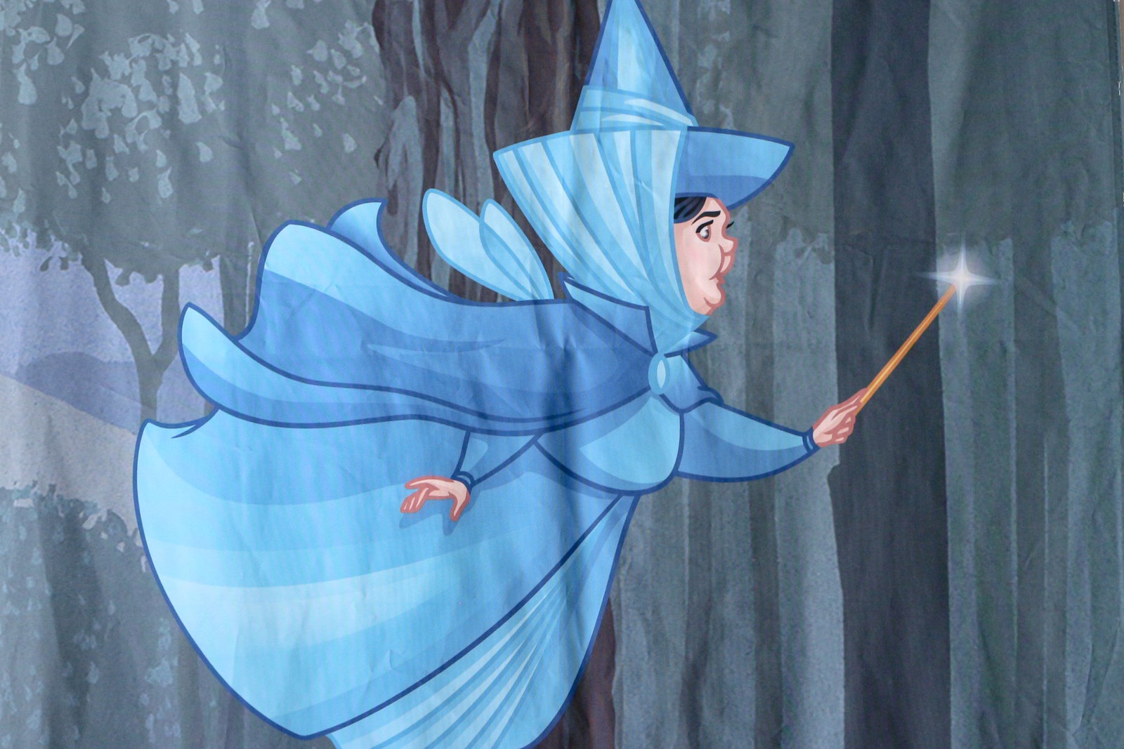 D23 Expo Sleeping Beauty Banner Featuring Fairy Merryweather: (Disney, c. 2019) In celebration of Sleeping Beauty's 60th Anniversary the makeup company Besame in partnership with Disney decorated a booth at the D23 Expo with this gorgeous fabric Banner featuring