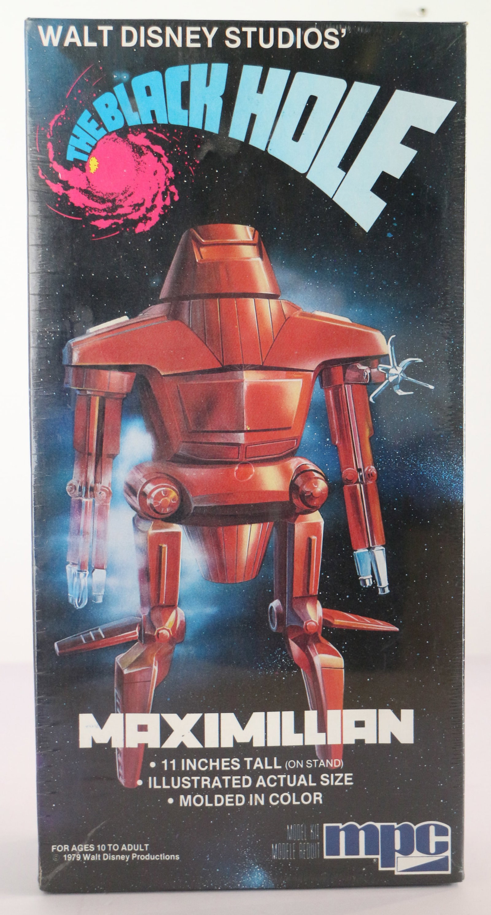 The Black Hole Maximilian Movable Replica Figure Still Sealed in Box.: (Disney, 1979). “A journey that begins where everything ends.” Disney’s The Black Hole was a significant film for the company when it debuted in 1979. It marked Disney’s first PG rated fil