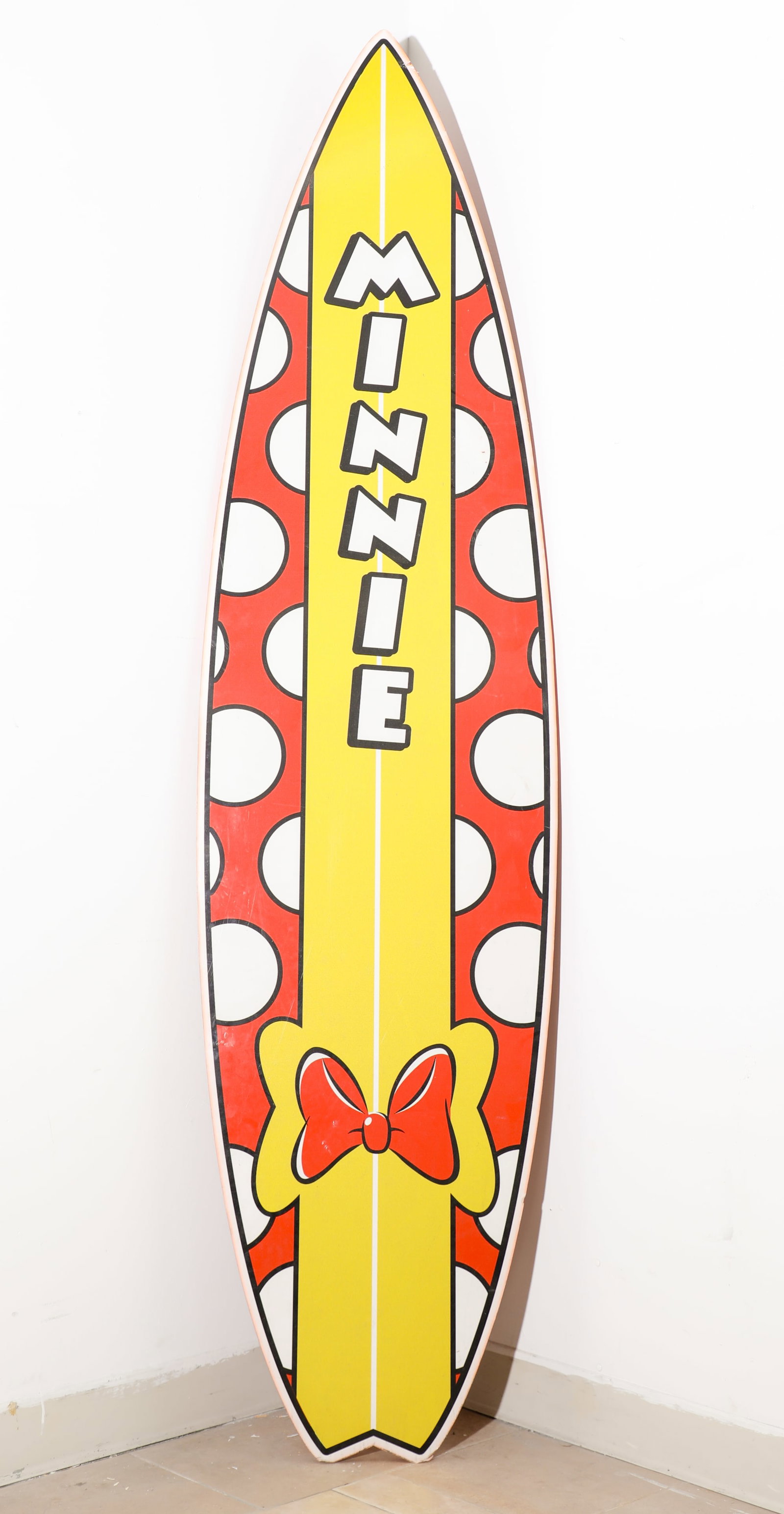 California Adventure Sunshine Plaza Minnie Mouse Surfboard Prop.: (California Adventure, c. 2003) "It's so hot, it's cool". This large surfboard prop features a design based on none other than the lovely Minnie Mouse. Her red bow and polka dot pattern provide a perf