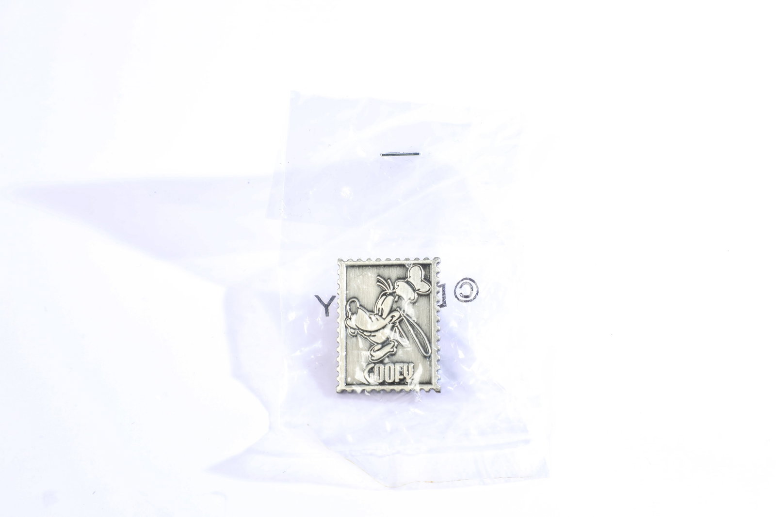 Disneyland Cast Exclusive Pewter Goofy Stamp Pin (Disney, 2000).: Walt Disney’s Goofy is the star of the Disneyland Resort Pewter Stamp Pin of the Month! This Cast Exclusive Pin is a limited edition of 2000, originally released September 1, 2000. Measuring approxi