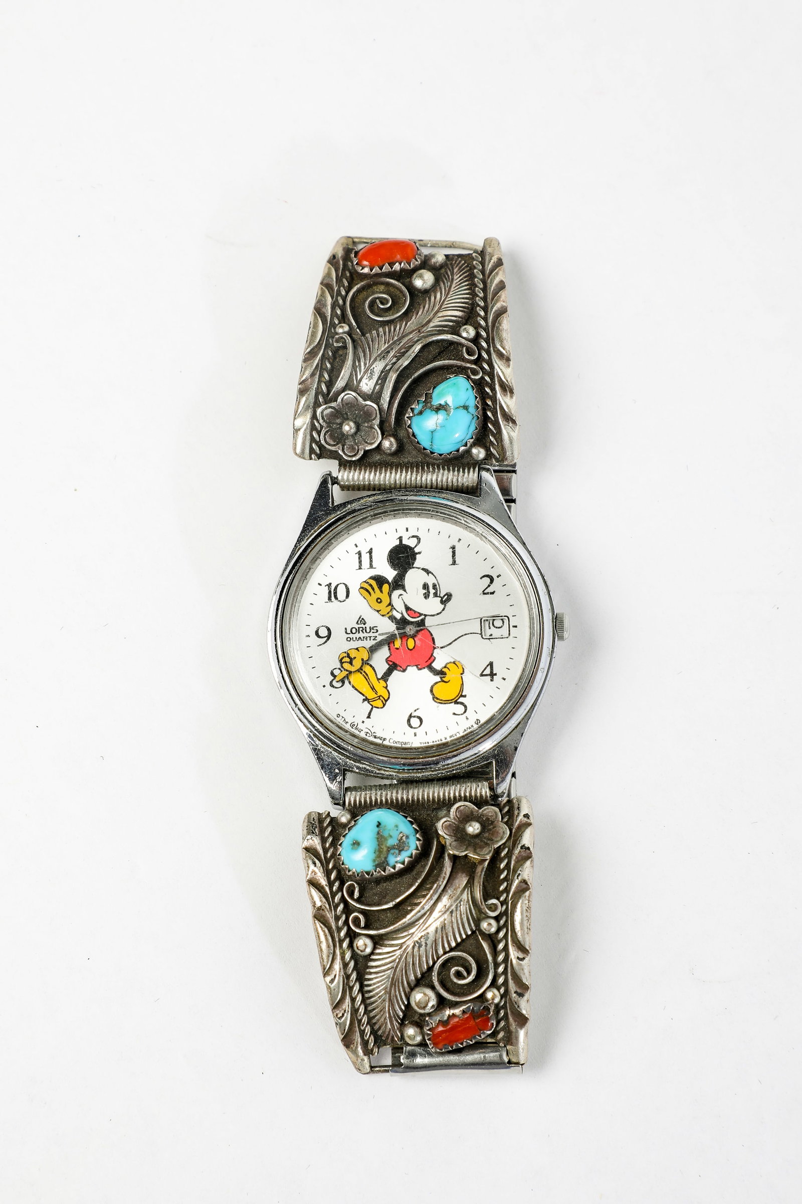 Disney-Lorus - Mickey Mouse Quartz Wrist Watch (c. 1990s): Walt Disney’s most memorable cartoon creation is the star of this vintage edition of the Disney-Lorus Mickey Mouse Wrist Watch by Seiko! The face showcases Mickey, sporting his yellow gloves and a 1