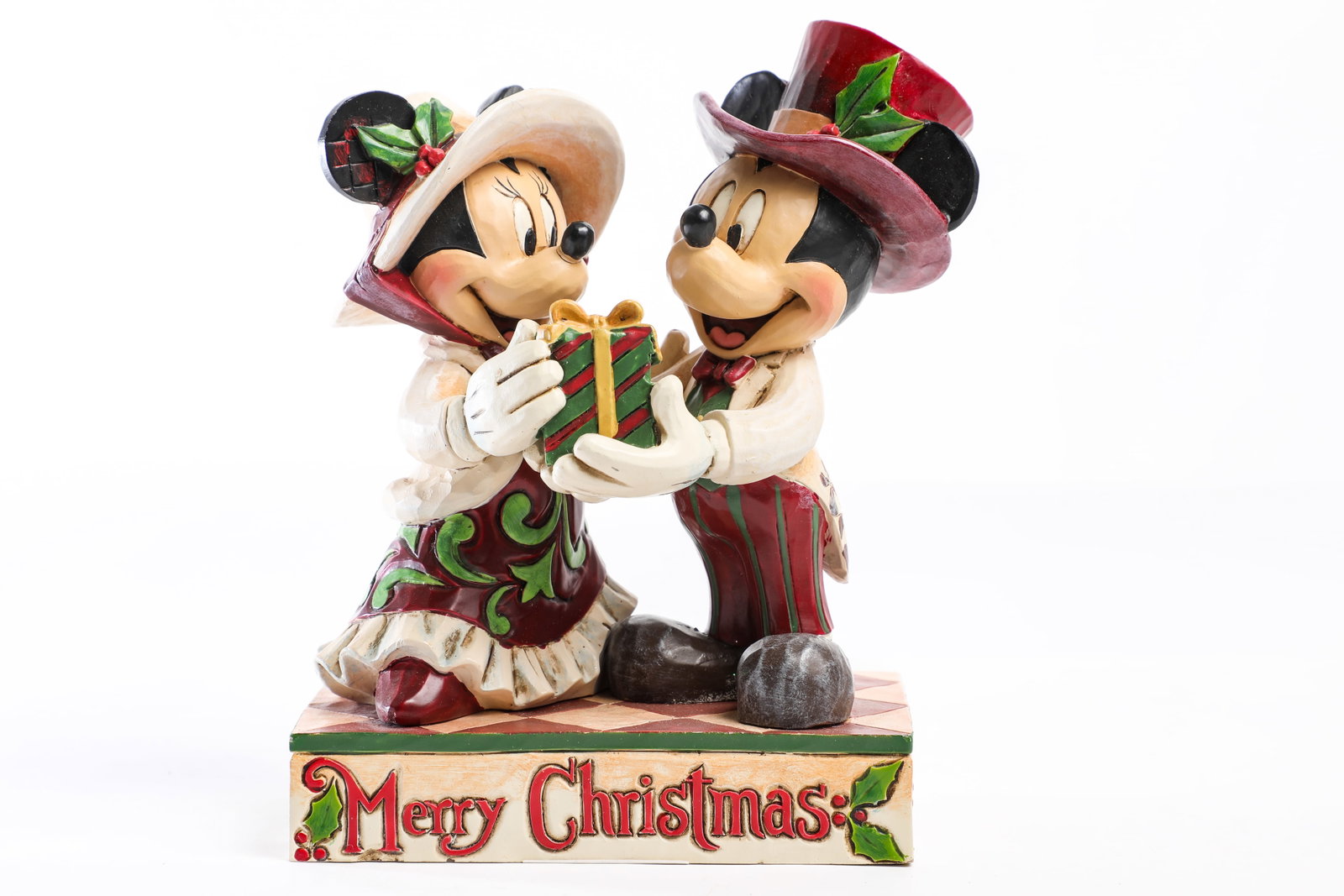 Jim Shore Disney Traditions - "Victorian Mickey & Minnie Mouse” Figure (2014).: “On the first day of Christmas, my true love gave to me…” Sweethearts Mickey Mouse and Minnie Mouse share a merry Christmas gift for the 2014 Jim Shore Disney Traditions "Victorian Mickey an
