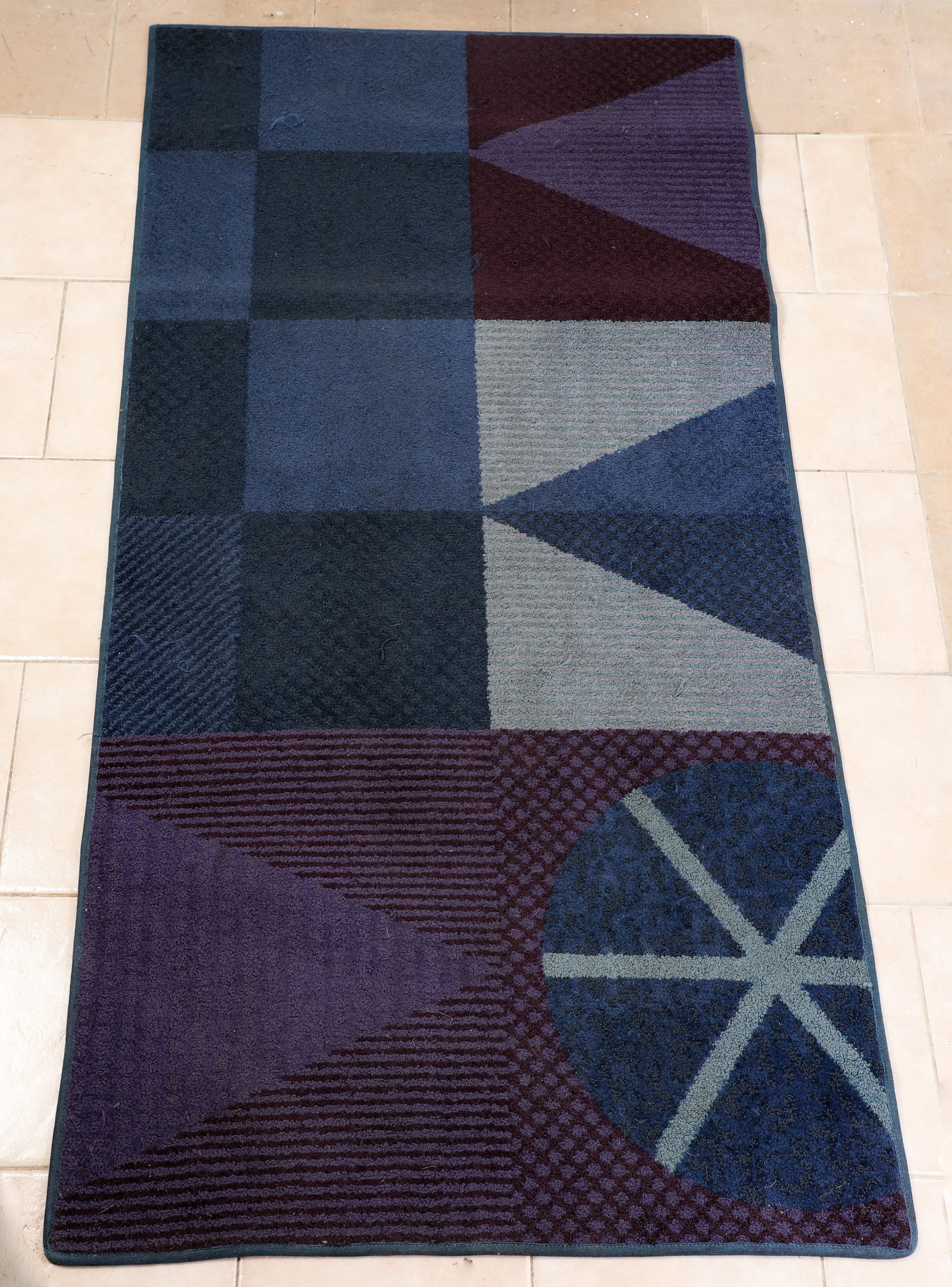 Disneyland Hotel - Fantasy Tower Winter Seasonal Rug (2000s).: Inspired by Mary Blair, this winter-season accent rug decorated areas of the Disneyland Hotel! The synthetic floor covering features a cool-toned pattern that is seemingly inspired by the facade of it