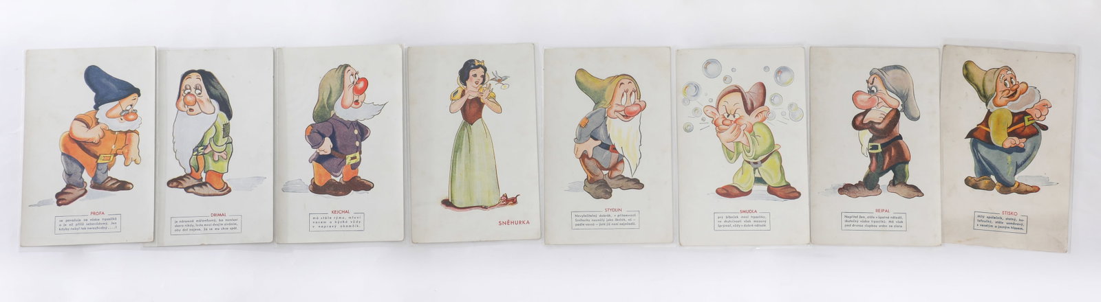 Snow White and the Seven Dwarfs Complete (Czech) Post Card Set (Walt Disney, 1938): “Over the seven jewelled hills, beyond the seventh fall,” comes this complete set of (8) promotional post cards from the Czech-language release of Walt Disney’s Snow White and the Seven Dwar