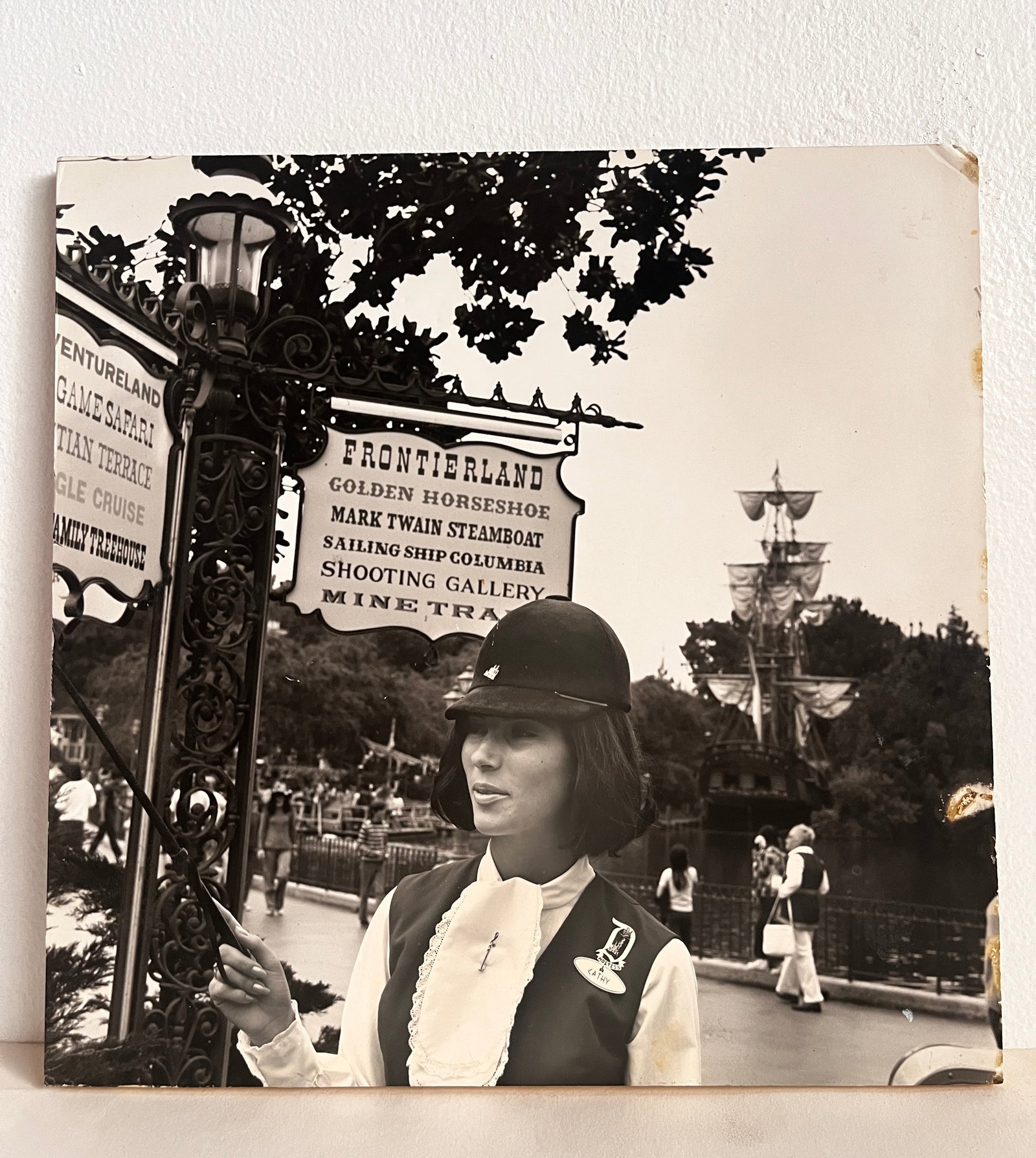Disneyland Tour Guide Display (1965-1970s): This original backstage display celebrates one wonderful way to enjoy Disneyland - through a Disneyland Guided Tour! This plaque showcases a late 1960s or early 1970s era, black-and-white image of a G