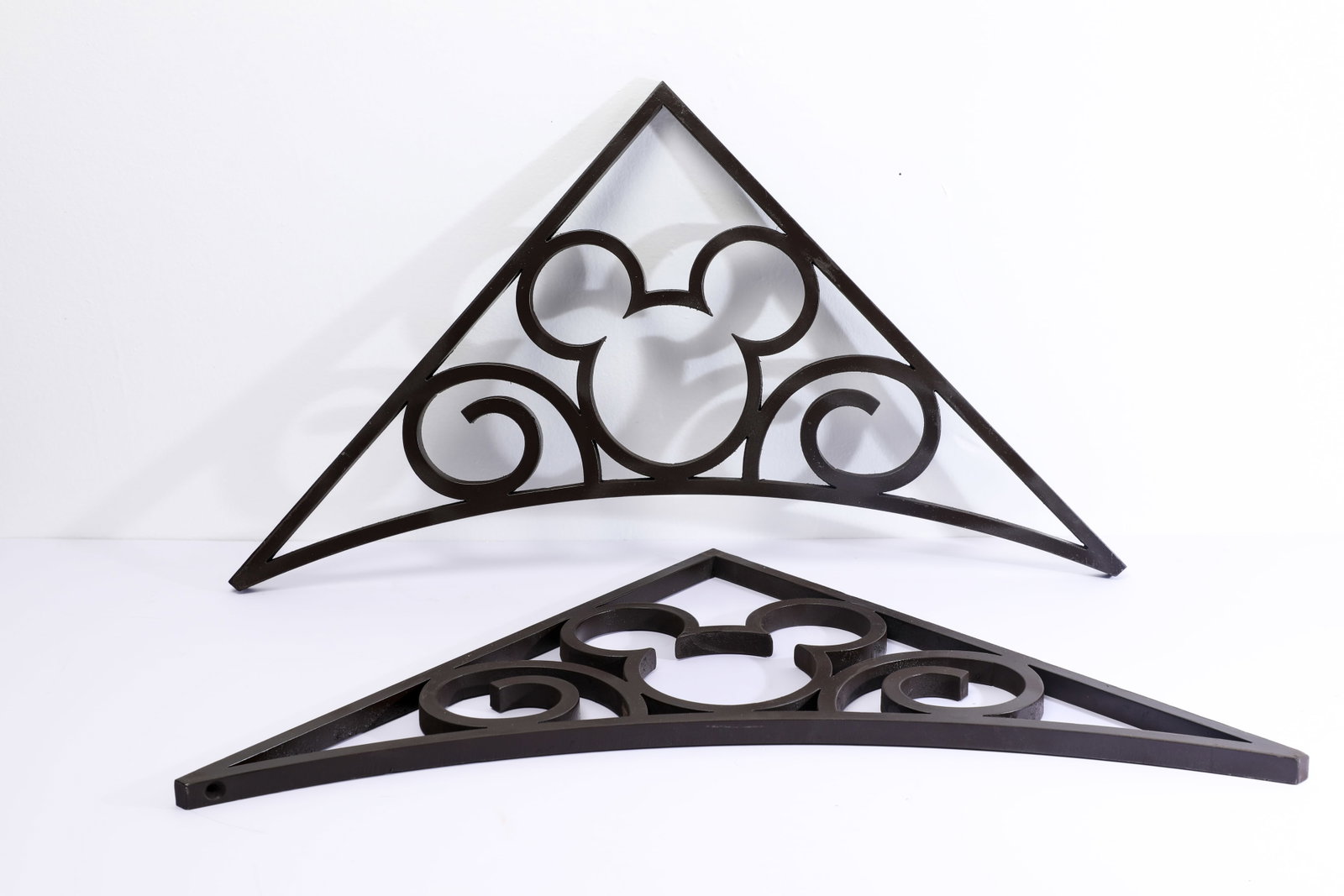 Disneyland Resort - Pair of Mickey Icon Decorative Metal Brackets (Disneyland, 2000s): “It all started with a mouse.” This is a rare pair of metal fixtures features a “hidden” Mickey icon pattern embellished exterior areas of Disneyland Resort. These accent decorations a